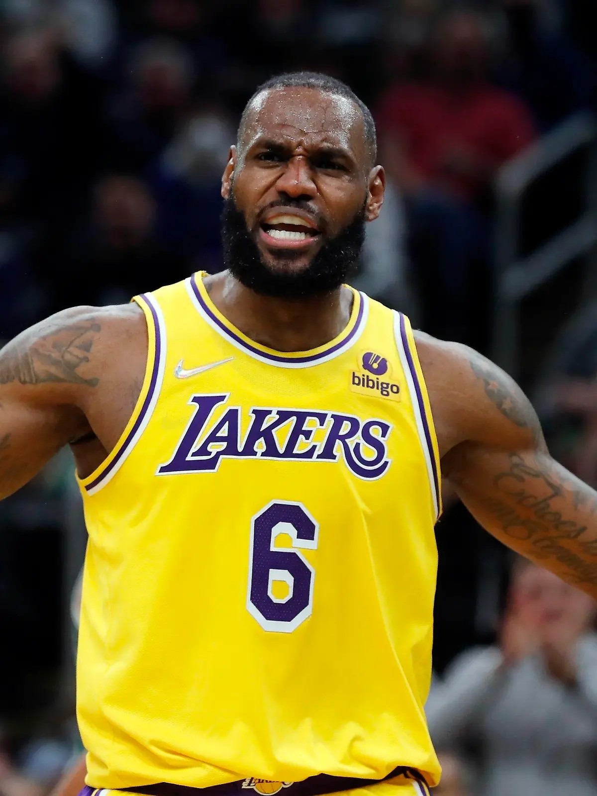 Los Angeles Lakers' LeBron James reacts to a call during the first half of an NBA basketball game against the Boston Celtics, Friday, Nov. 19, 2021, in Boston. (AP Photo/Michael Dwyer)