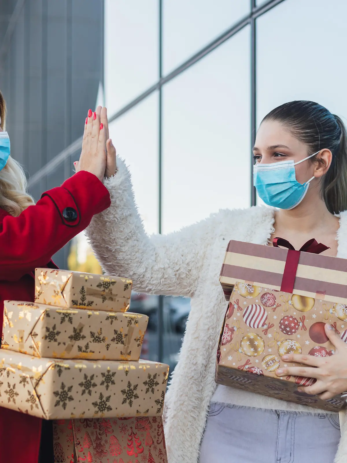 Family shopping Christmas gifts during COVID-19 pandemic. They wears a protective mask to protect from corona virus COVID-19.