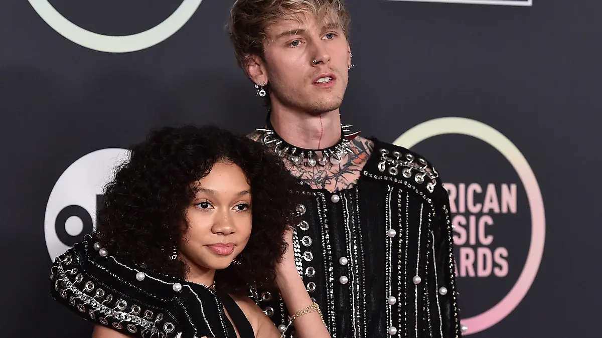 Machine Gun Kelly, right, and daughter Casie Colson Baker arrive at the American Music Awards on Sunday, Nov. 21, 2021, at Microsoft Theater in Los Angeles. (Photo by Jordan Strauss/Invision/AP)