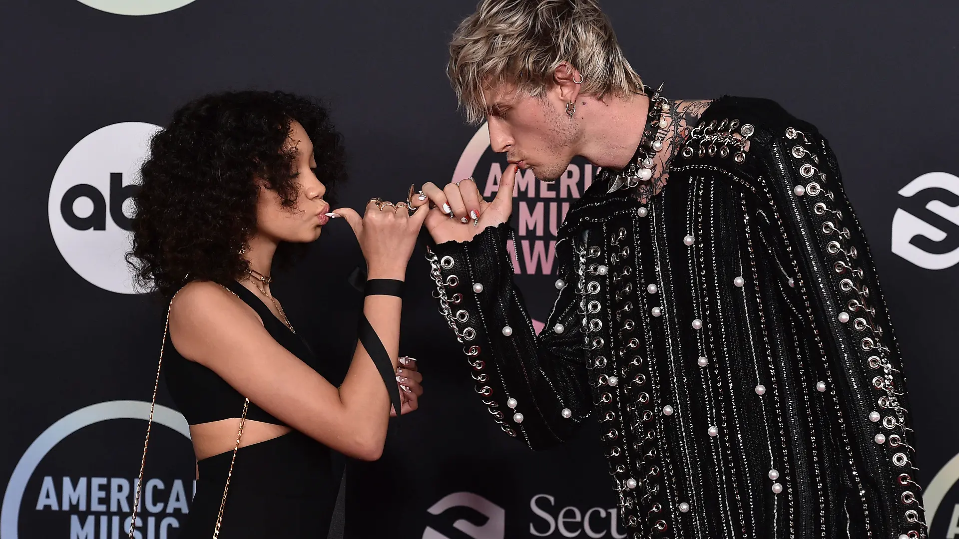 Machine Gun Kelly, right, and daughter Casie Colson Baker arrive at the American Music Awards on Sunday, Nov. 21, 2021, at Microsoft Theater in Los Angeles. (Photo by Jordan Strauss/Invision/AP)