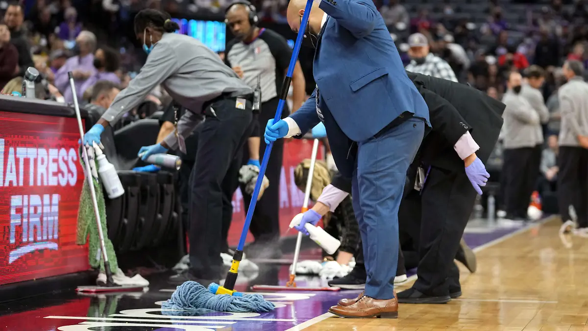 Nov 20, 2021; Sacramento, California, USA; The sideline is cleaned causing a delay during the fourth quarter of the game between the Sacramento Kings and the Utah Jazz at Golden 1 Center. Mandatory Credit: Darren Yamashita-USA TODAY Sports