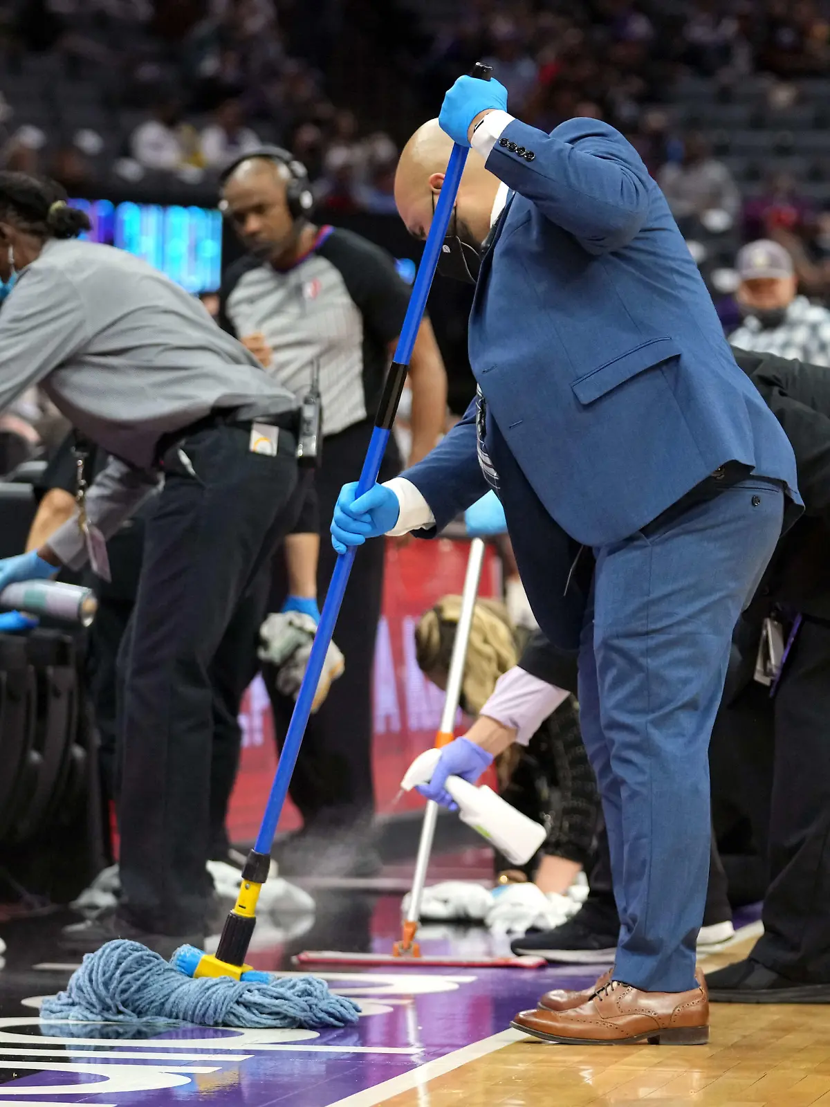 Nov 20, 2021; Sacramento, California, USA; The sideline is cleaned causing a delay during the fourth quarter of the game between the Sacramento Kings and the Utah Jazz at Golden 1 Center. Mandatory Credit: Darren Yamashita-USA TODAY Sports