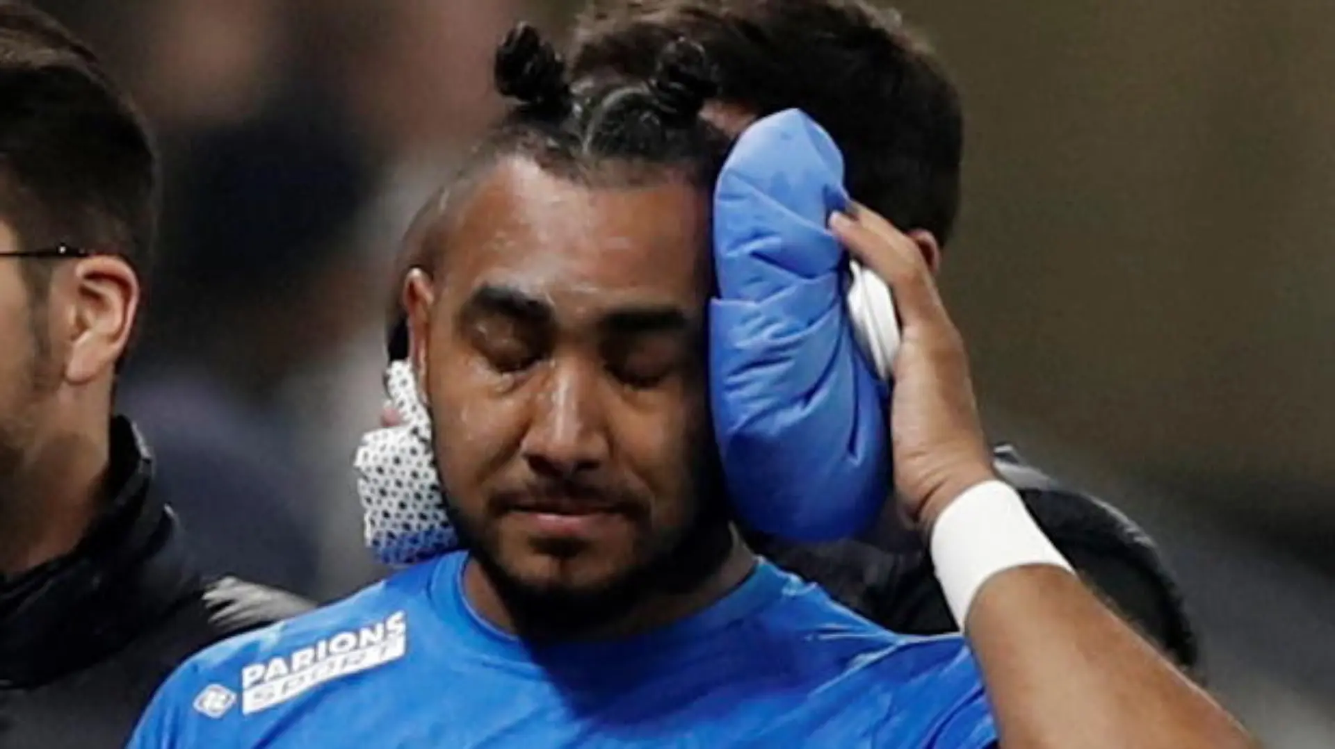 Soccer Football - Ligue 1 - Olympique Lyonnais v Olympique de Marseille - Groupama Stadium, Lyon, France - November 21, 2021  Olympique de Marseille's Dimitri Payet walks off the pitch injured after being hit by a water bottle thrown by a fan leading to the game being interrupted REUTERS/Benoit Tessier