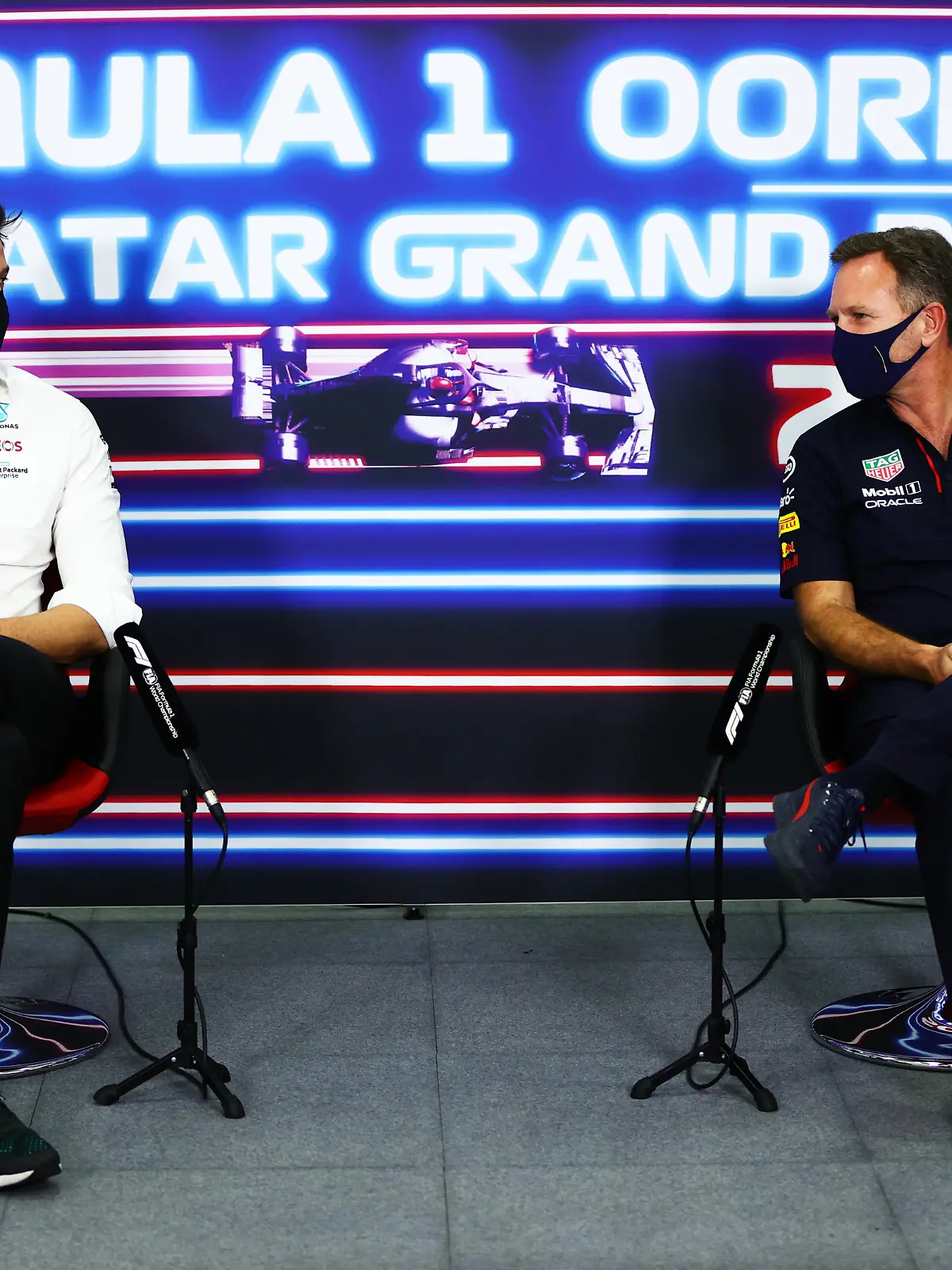 DOHA, QATAR - NOVEMBER 19: Mercedes GP Executive Director Toto Wolff and Red Bull Racing Team Principal Christian Horner talk in the Team Principals Press Conference during practice ahead of the F1 Grand Prix of Qatar at Losail International Circuit on November 19, 2021 in Doha, Qatar. (Photo by Dan Istitene/Getty Images)