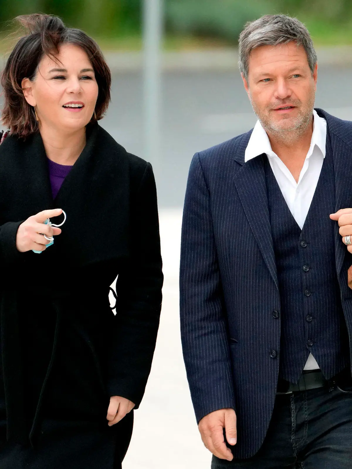 FILE -- Our combination picture shows from left, Christian Lindner, chairman of the German Liberals (FDP), Annalena Baerbock, co-chairwoman of the German Green party (Die Gruenen), Robert Habeck, co-chairman of the German Green party (Die Gruenen) and Olaf Scholz of the German Social Democratic Party (SPD), as they arrive for coalition negotiations in Berlin, Germany, Thursday, Oct. 21, 2021. The three German parties said Tuesday that they hope to clinch a deal next week to form a new government, allowing center-left leader Olaf Scholz to become the country's new leader in early December. (AP Photos/Michael Sohn, file)