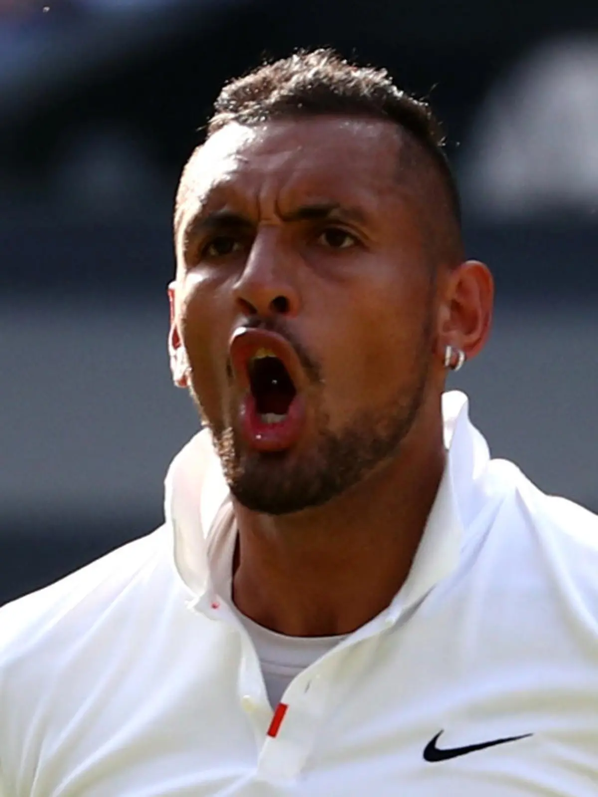 Tennis - Wimbledon - All England Lawn Tennis and Croquet Club, London, Britain - July 4, 2019  Australia's Nick Kyrgios reacts during his second round match against Spain's Rafael Nadal  REUTERS/Hannah McKay