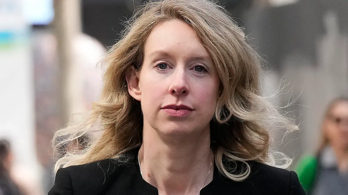 FILE - Former Theranos CEO Elizabeth Holmes leaves federal court in San Jose, Calif., March 17, 2023. Holmes has asked a federal judge, Wednesday, May 17, 2023, to allow her to remain free through the Memorial Day weekend before surrendering to authorities on May 30, to begin her more than 11-year prison sentence for defrauding investors in a blood-testing scam. (AP Photo/Jeff Chiu, File)