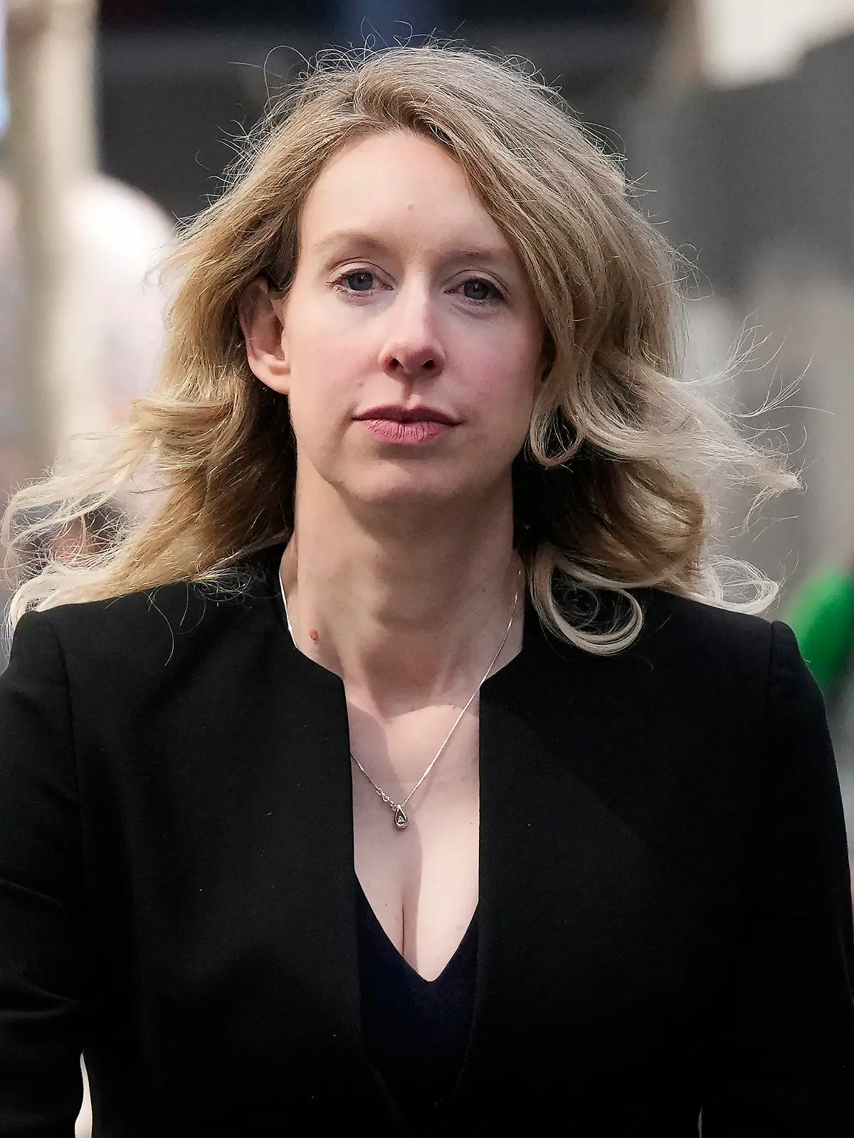 FILE - Former Theranos CEO Elizabeth Holmes leaves federal court in San Jose, Calif., March 17, 2023. Holmes has asked a federal judge, Wednesday, May 17, 2023, to allow her to remain free through the Memorial Day weekend before surrendering to authorities on May 30, to begin her more than 11-year prison sentence for defrauding investors in a blood-testing scam. (AP Photo/Jeff Chiu, File)