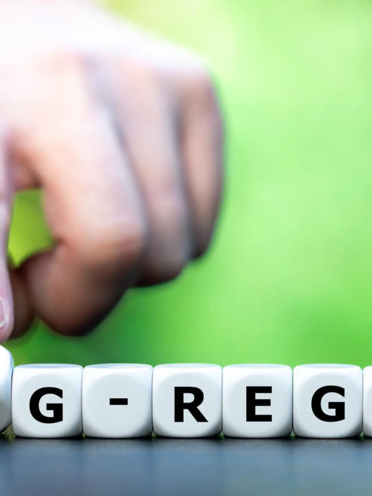 Symbol for the regulation that only vaccinated and recovered people have access to certain events. Hand is turning a dice and changes the expression "3G-Regel" (3G-rule) to "2G-Regel"(2G-rule)