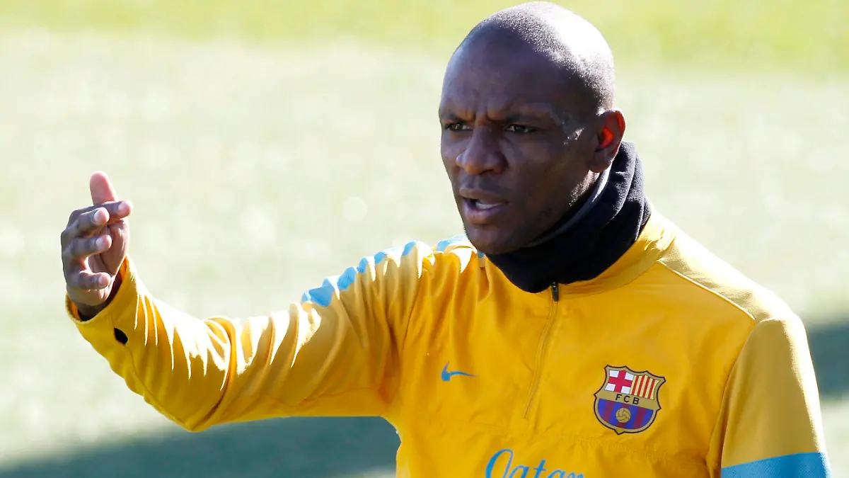 Barcelona's Eric Abidal gestures to his team mates during a training session at Ciutat Esportiva Joan Gamper in Sant Joan Despi near Barcelona. February 13, 2013. REUTERS/Gustau Nacarino(SPAIN - Tags: SPORT SOCCER)