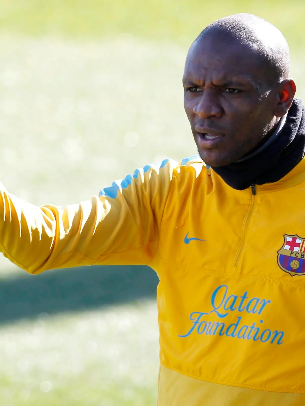 Barcelona's Eric Abidal gestures to his team mates during a training session at Ciutat Esportiva Joan Gamper in Sant Joan Despi near Barcelona. February 13, 2013.     REUTERS/Gustau Nacarino(SPAIN - Tags: SPORT SOCCER)