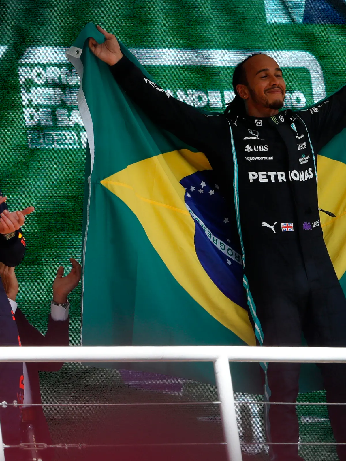 Mercedes driver Lewis Hamilton, of Britain, right, celebrates his victory over Red Bull driver Max Verstappen, of The Netherlands, right, in the Brazilian Formula One Grand Prix at the Interlagos race track in Sao Paulo, Brazil, Sunday, Nov. 14, 2021. Max Verstappen finished second. (AP Photo/Marcelo Chello)