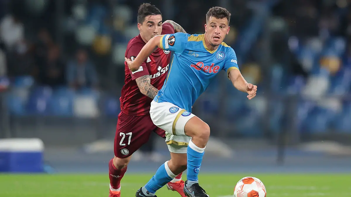 Napoli's Diego Demme, right, and Legia's Josue fight for the ball during a group C Europa League soccer match between Napoli and Legia, at Naples’ Diego Armando Maradona Stadium, Italy, Thursday, Oct. 21, 2021. (Alessandro Garofalo/LaPresse via AP)