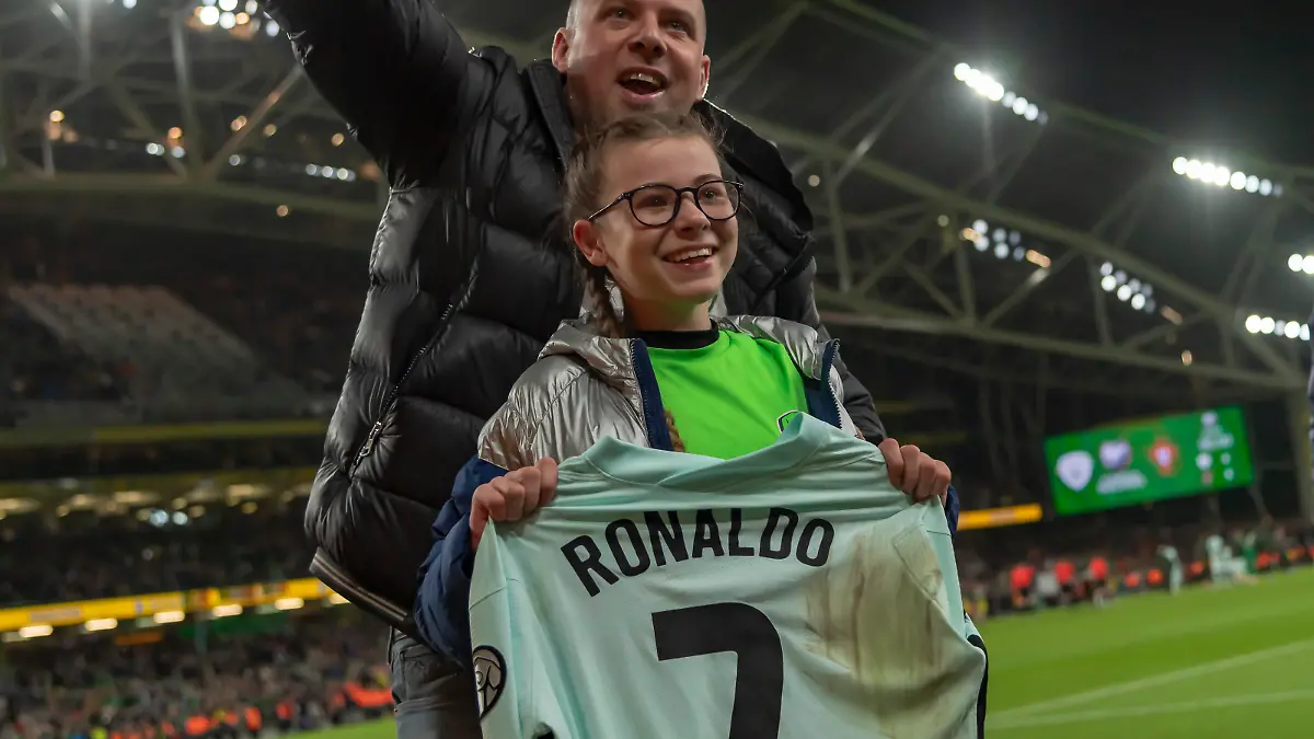 CRISTIANO RONALDO gives his shirt to young Addison Whelan after the FIFA World Cup 2022 Group A Qualifying match between Republic of Ireland and Portugal, Aviva stadium, Dublin, Ireland, 11.11.2021, Credit:Anthony Stanley / Avalon