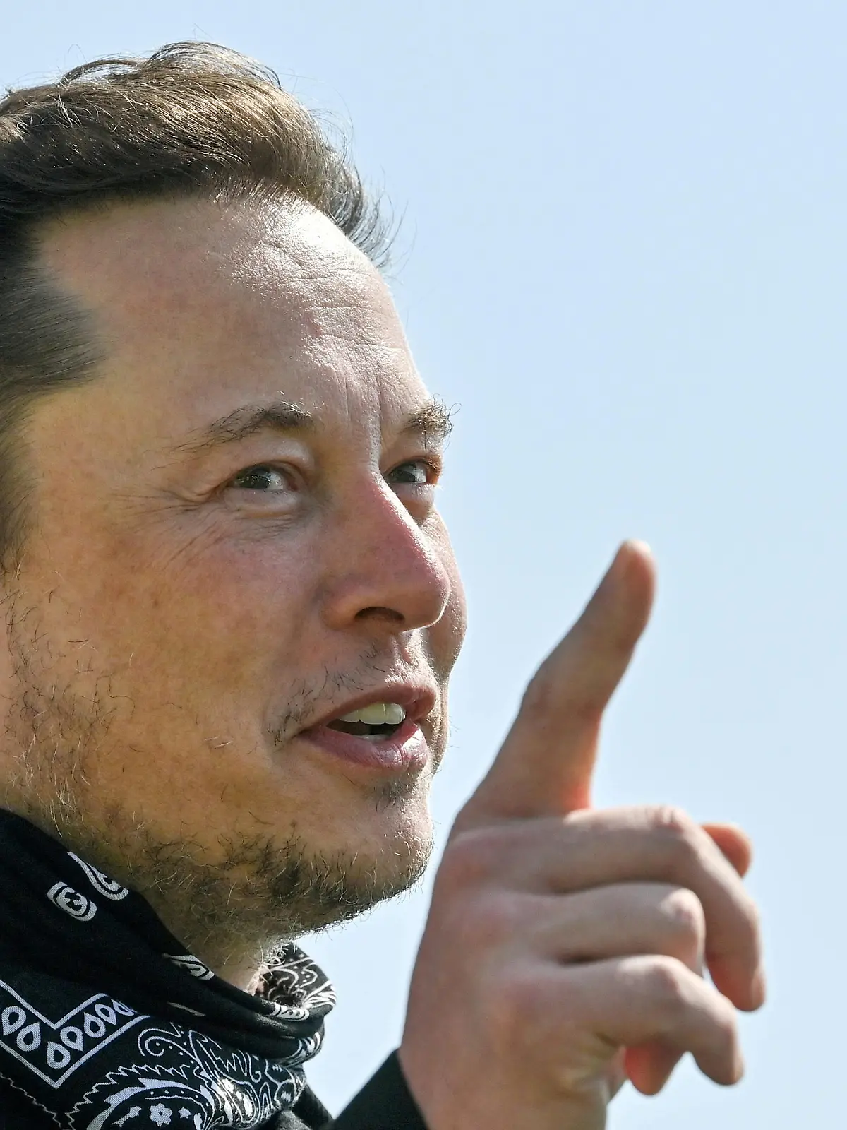 FILE PHOTO: Tesla CEO Elon Musk gestures as he visits the construction site of Tesla's Gigafactory in Gruenheide near Berlin, Germany, August 13, 2021. Patrick Pleul/Pool via Reuters/File Photo/File Photo
