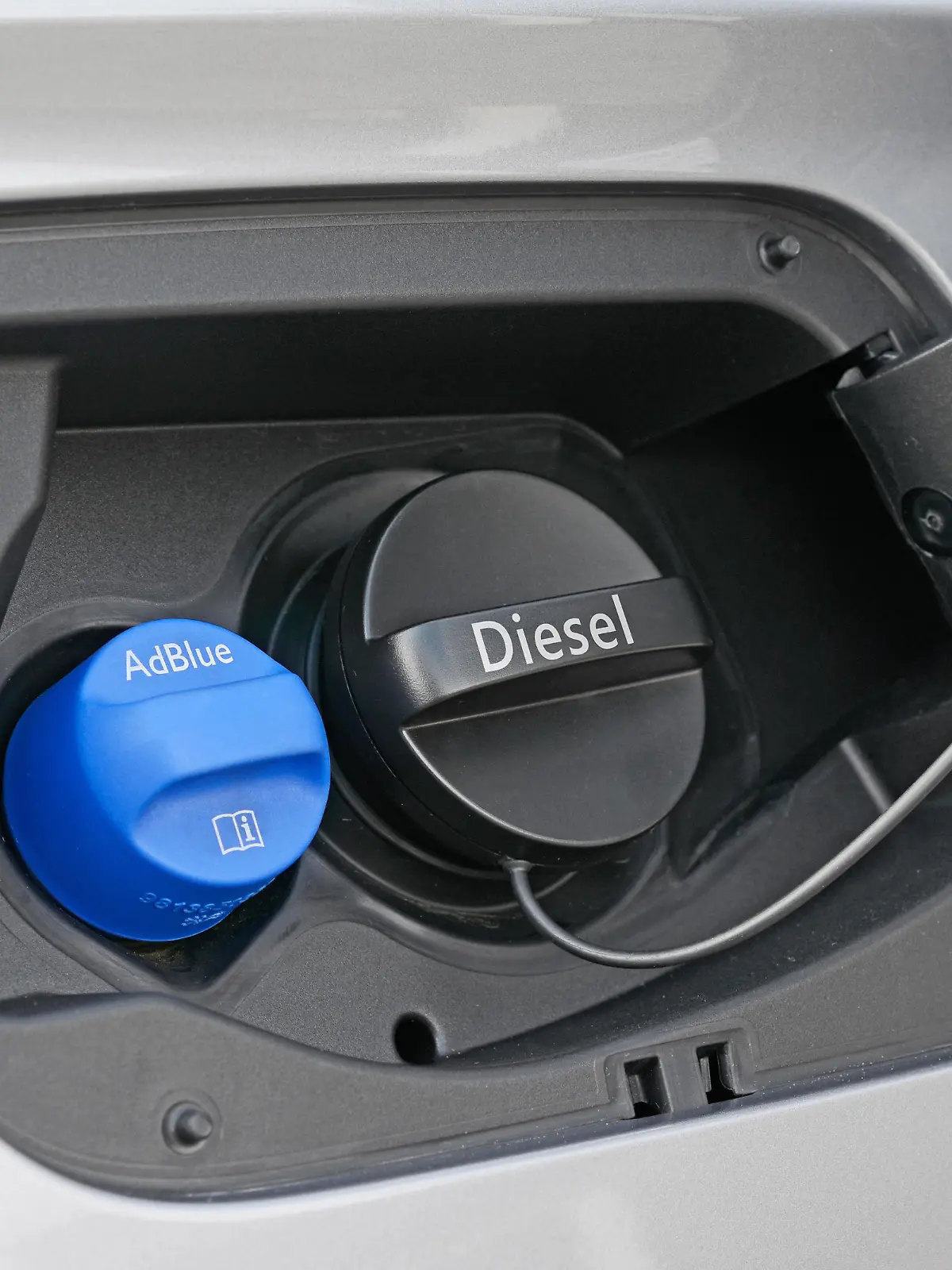 Tank filler necks for AdBlue and Diesel of a modern car.