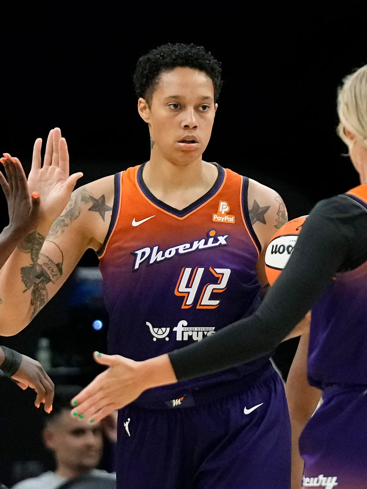 Phoenix Mercury center Brittney Griner (42) celebrates her score against the Minnesota Lynx with Sophie Cunningham, right, and Michaela Onyenwere, left, during the first half of a WNBA basketball game Thursday, May 25, 2023, in Phoenix. The Mercury won 90-81. (AP Photo/Ross D. Franklin)