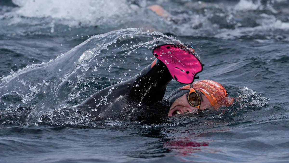 France's Paralympic swimmer Theo Curin swims across Titicaca Lake from Copacabana, Bolivia, Wednesday, Nov. 10, 2021. Curin, along with France's former Olympic swimmer Malia Metella and France's eco-adventurer Matthieu Witvoet, intends to cross Titicaca Lake in 10 days, from Copacabana, Bolivia to Isla de Los Urus, Peru. (AP Photo/Juan Karita)
