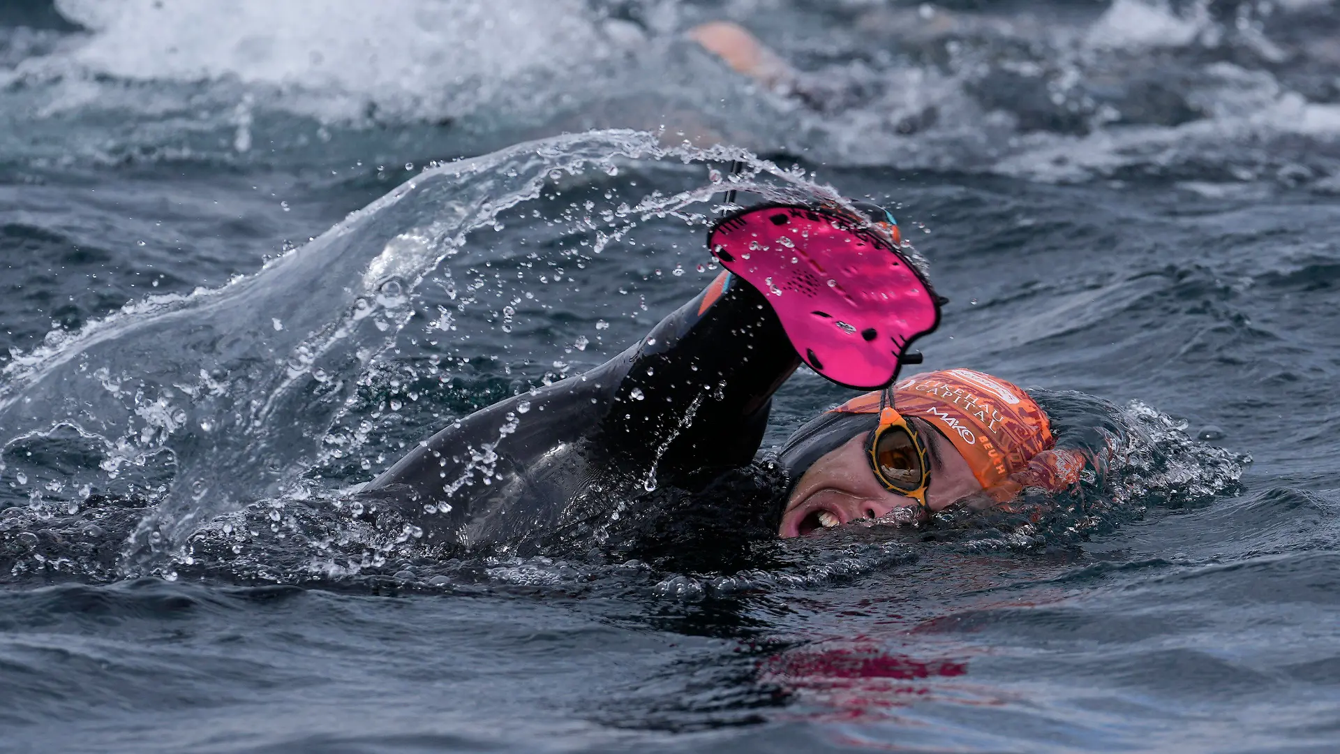 France's Paralympic swimmer Theo Curin swims across Titicaca Lake from Copacabana, Bolivia, Wednesday, Nov. 10, 2021. Curin, along with France's former Olympic swimmer Malia Metella and France's eco-adventurer Matthieu Witvoet, intends to cross Titicaca Lake in 10 days, from Copacabana, Bolivia to Isla de Los Urus, Peru. (AP Photo/Juan Karita)