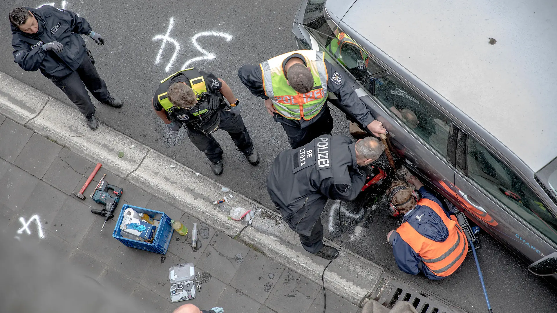 May 23, 2023, Berlin, Germany: On May 23, 2023, the climate activists group ''Letzte Generation'' (Last Generation) blocked the A100 freeway. They adhered themselves to rental cars and a rental van using glue. They also attached themselves to the tires of vehicles. As a result, the police had to deploy heavy equipment near the Paulsborner BrÃ¼cke (Paulsborn Bridge) to remove the activists. The blockade on the A100 is one of the group's actions aimed at pressuring the German government to take more robust measures against the climate crisis. The activists of the ''Letzte Generation'' employ methods of civil disobedience to enforce their demands. The group has gained attention and faced criticism due to using glue to attach themselves to road surfaces during protests. However, the public's response to their actions has been largely negative. These blockades often lead to legal convictions, mainly for coercion, in Germany. Many activists have been fined. (Credit Image: © Michael Kuenne/PRESSCOV via ZUMA Press Wire) / action press