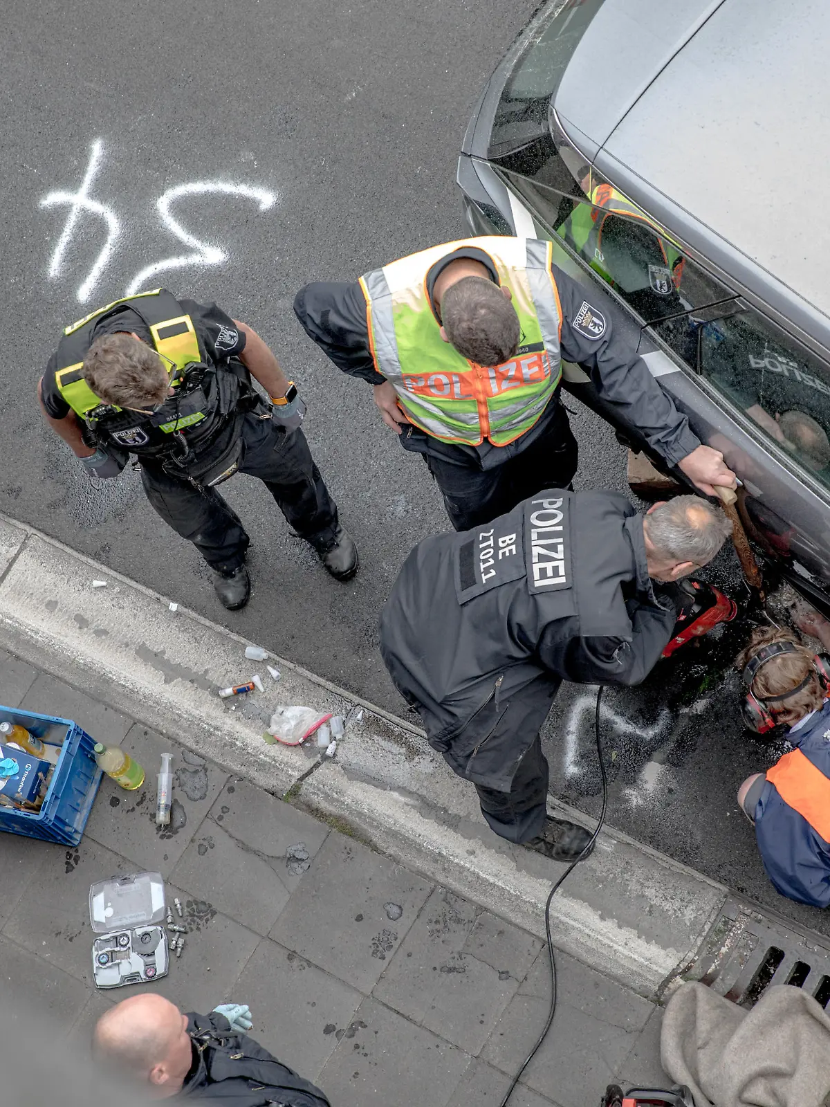 May 23, 2023, Berlin, Germany: On May 23, 2023, the climate activists group ''Letzte Generation'' (Last Generation) blocked the A100 freeway. They adhered themselves to rental cars and a rental van using glue. They also attached themselves to the tires of vehicles. As a result, the police had to deploy heavy equipment near the Paulsborner BrÃ¼cke (Paulsborn Bridge) to remove the activists. The blockade on the A100 is one of the group's actions aimed at pressuring the German government to take more robust measures against the climate crisis. The activists of the ''Letzte Generation'' employ methods of civil disobedience to enforce their demands. The group has gained attention and faced criticism due to using glue to attach themselves to road surfaces during protests. However, the public's response to their actions has been largely negative. These blockades often lead to legal convictions, mainly for coercion, in Germany. Many activists have been fined. (Credit Image: © Michael Kuenne/PRESSCOV via ZUMA Press Wire) / action press