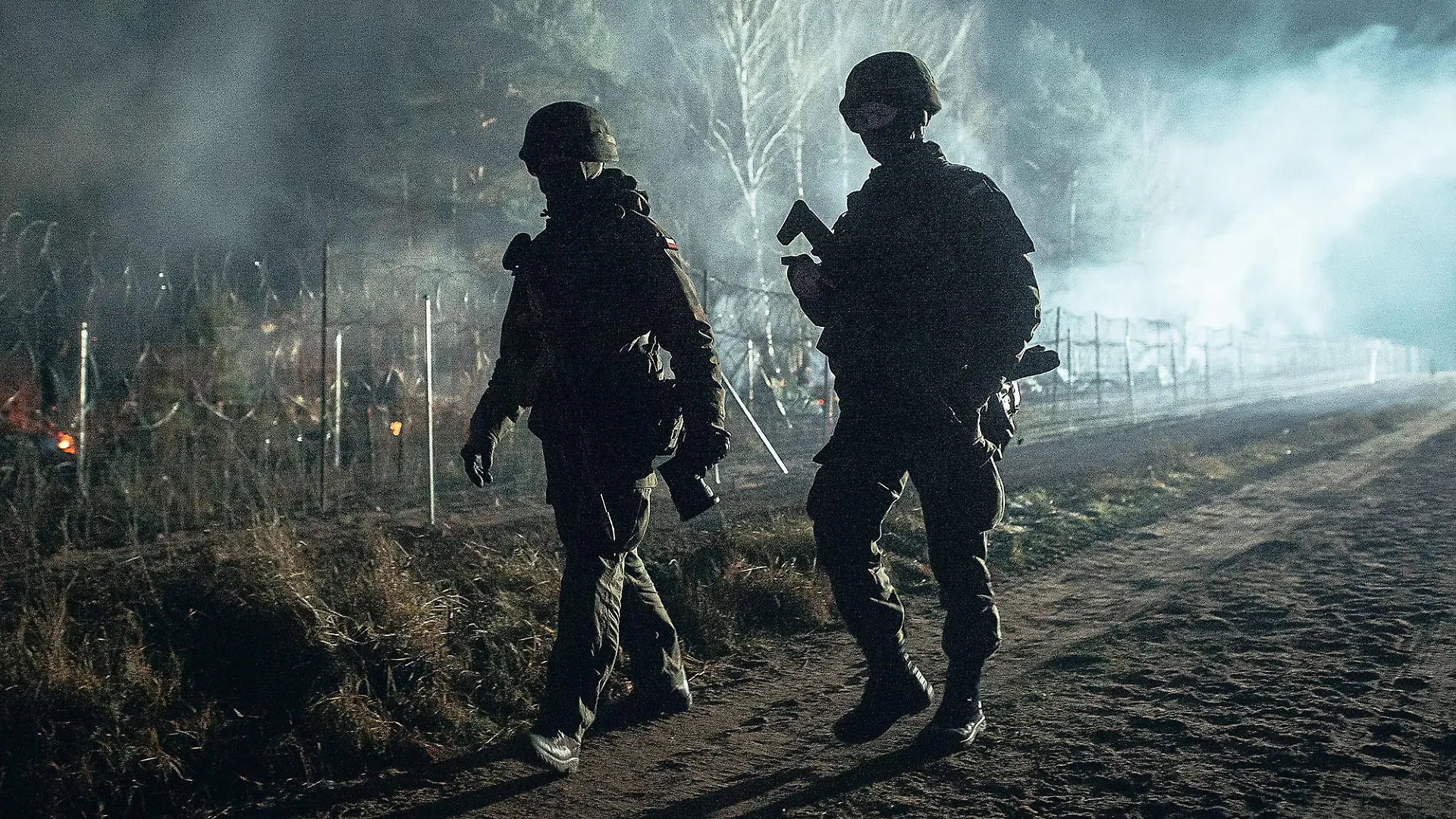 Polish soldiers patrol Poland/Belarus border near Kuznica, Poland, in this photograph released by the Polish Defence Ministry, November 9, 2021. Irek Dorozanski/DWOT/Handout via REUTERS THIS IMAGE HAS BEEN SUPPLIED BY A THIRD PARTY