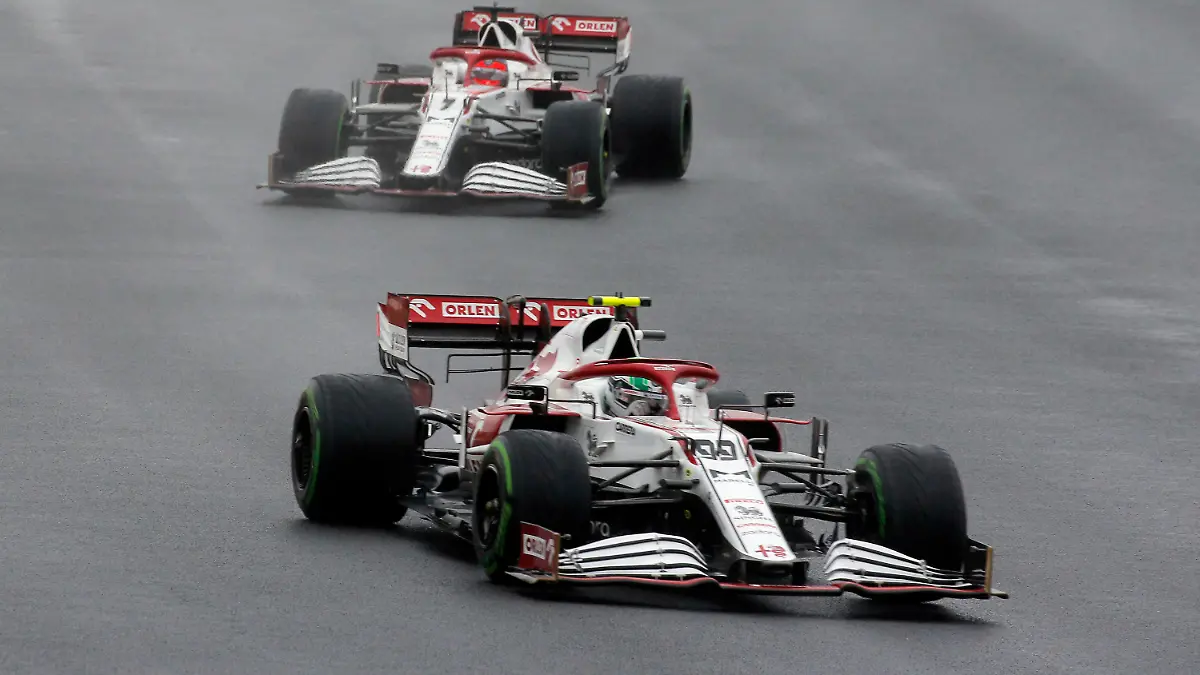 Alfa Romeo driver Antonio Giovinazzi of Italy steers his car followed by Alfa Romeo driver Kimi Raikkonen of Finland during the Turkish Formula One Grand Prix at the Intercity Istanbul Park circuit in Istanbul, Turkey, Sunday, Oct. 10, 2021. (AP Photo)