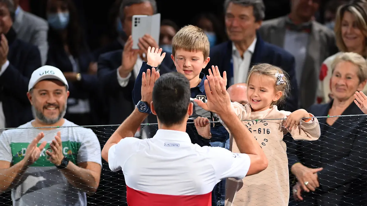 PARIS, FRANCE - NOVEMBER 07: Novak Djokovic of Serbia celebrates with his family after winning the mens singles final against Daniil Medvedev of Russia on day seven of the Rolex Paris Masters at AccorHotels Arena on November 07, 2021 in Paris, France. (Photo by Justin Setterfield/Getty Images)