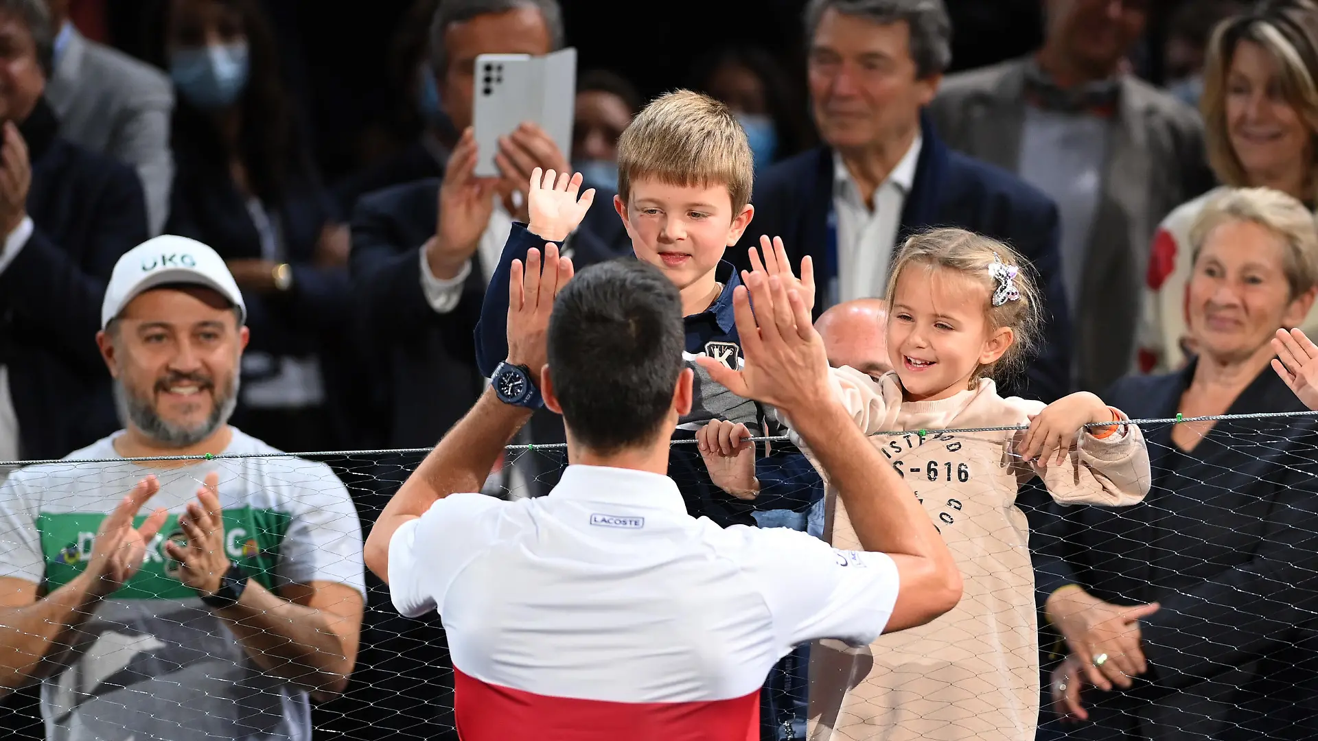 PARIS, FRANCE - NOVEMBER 07: Novak Djokovic of Serbia celebrates with his family after winning the mens singles final against Daniil Medvedev of Russia on day seven of the Rolex Paris Masters at AccorHotels Arena on November 07, 2021 in Paris, France. (Photo by Justin Setterfield/Getty Images)