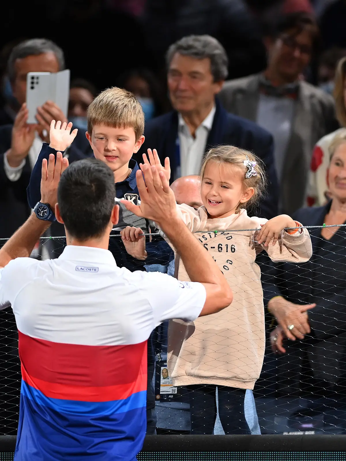 PARIS, FRANCE - NOVEMBER 07: Novak Djokovic of Serbia celebrates with his family after winning the mens singles final against Daniil Medvedev of Russia on day seven of the Rolex Paris Masters at AccorHotels Arena on November 07, 2021 in Paris, France. (Photo by Justin Setterfield/Getty Images)