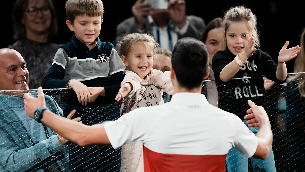 Serbia's Novak Djokovic goes his son Stefan after defeating Russia's Daniil Medvedev during the final match of the Paris Masters tennis tournament at the Accor Arena in Paris, Sunday, Nov.7, 2021. Djokovic won 4-6, 6-3, 6-3. (AP Photo/Thibault Camus)