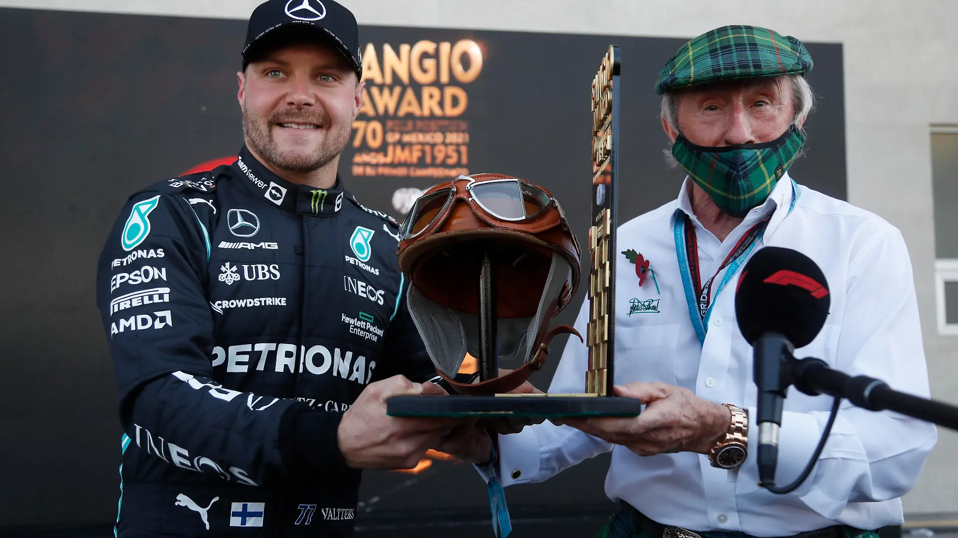 Formula One F1 - Mexico Grand Prix - Autodromo Hermanos Rodriguez, Mexico City, Mexico - November 6, 2021 Mercedes' Valtteri Bottas celebrates pole position with Jackie Stewart Pool via REUTERS/Francisco Guasco
