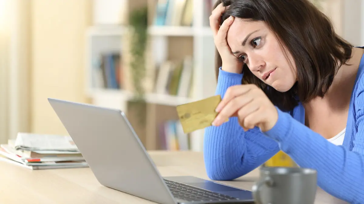 Worried woman buying online at home