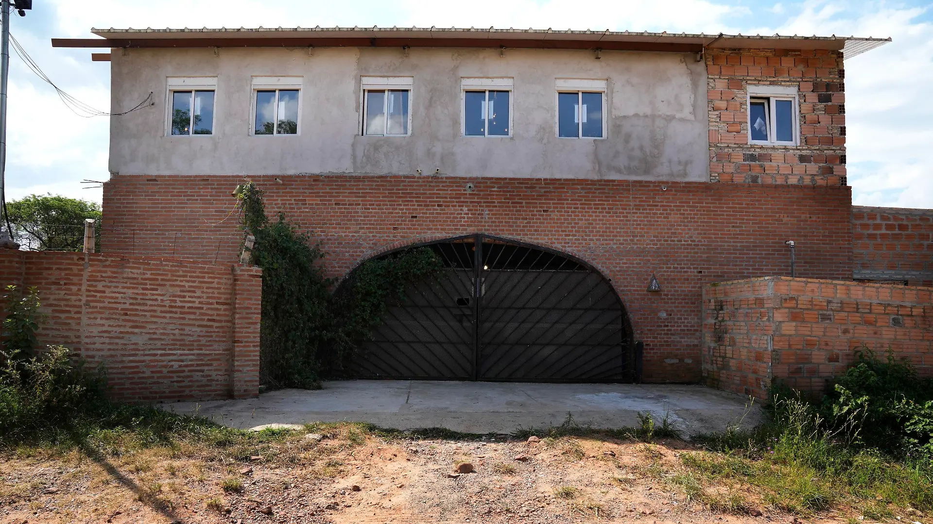 A view of the residence of German archeologist, musician and violin luthier, Bernard Raymond Von Bredow, in Aregua, Paraguay, Wednesday, Nov. 3, 2021. The bodies of Von Bredow, 62, and his 14-year-old daughter were found in the home on Oct. 22 with traces of violence. (AP Photo/Jorge Saenz)
