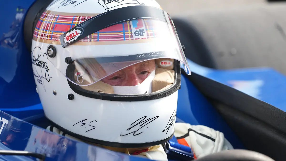 13.04.2025, Bahrain International Circuit, Sakhir, Formula 1 Gulf Air Bahrain Grand Prix 2025 ,pictured Triple F1 World Champion, Sir Jackie Stewart, drives his Tyrrell 006 race in Bahrain to benefit the global Race Against Dementia foundation. He is wearing a helmet signed by celebrities, including a recent signature from Michael Schumacher.
