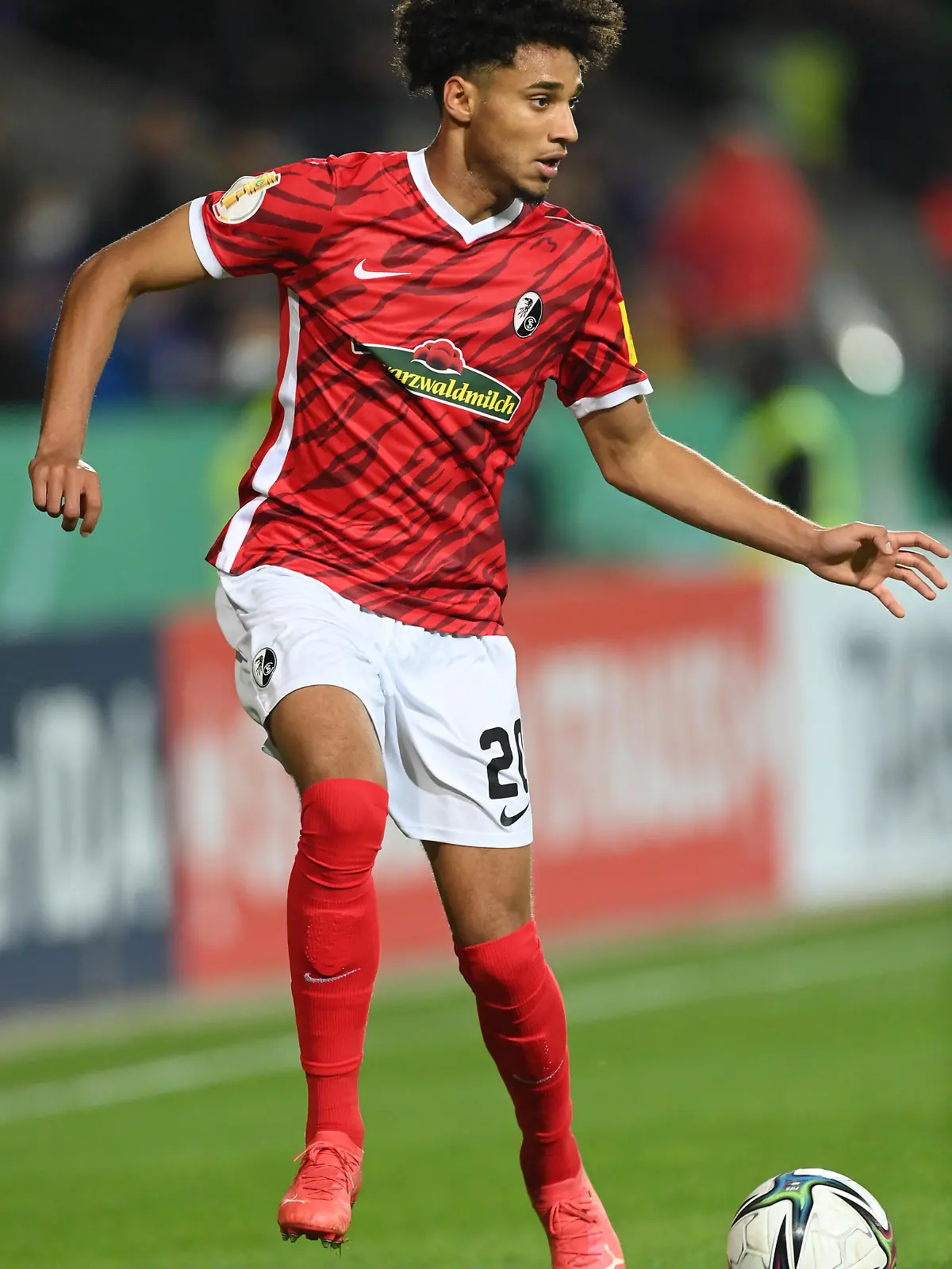 OSNABRUECK, GERMANY - OCTOBER 26: Kevin Schade  of Freiburg in action during the DFB Cup second round match between VfL Osnabrück and SC Freiburg at Stadion an der Bremer Brücke on October 26, 2021 in Osnabrueck, Germany. (Photo by Stuart Franklin/Getty Images)
