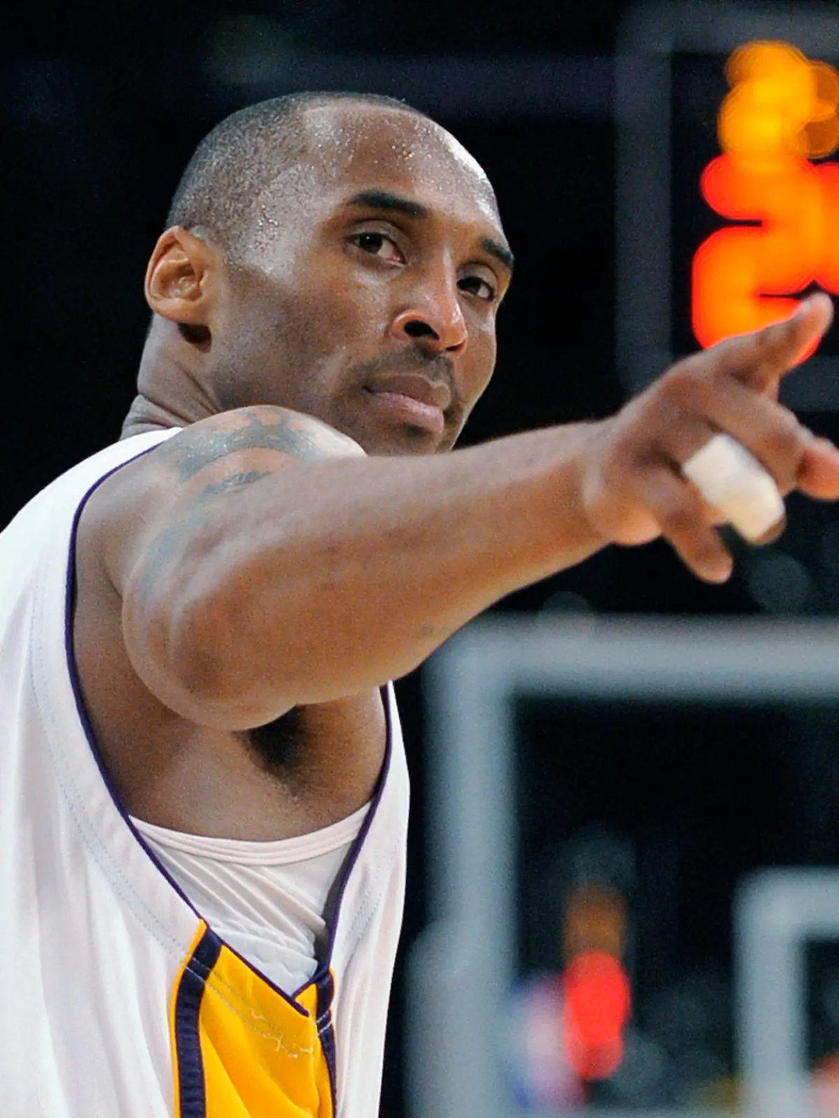 FILE - In this June 7, 2009, file photo, Los Angeles Lakers guard Kobe Bryant (24) points to a player behind him after making a basket in the closing seconds against the Orlando Magic in Game 2 of the NBA basketball finals in Los Angeles. Federal safety officials are expected to vote Tuesday, Feb. 9, 2021, on what likely caused the helicopter carrying Kobe Bryant, his 13-year-old daughter and seven others to crash into a Southern California hillside last year, killing all aboard. (AP Photo/Mark J. Terrill, file)