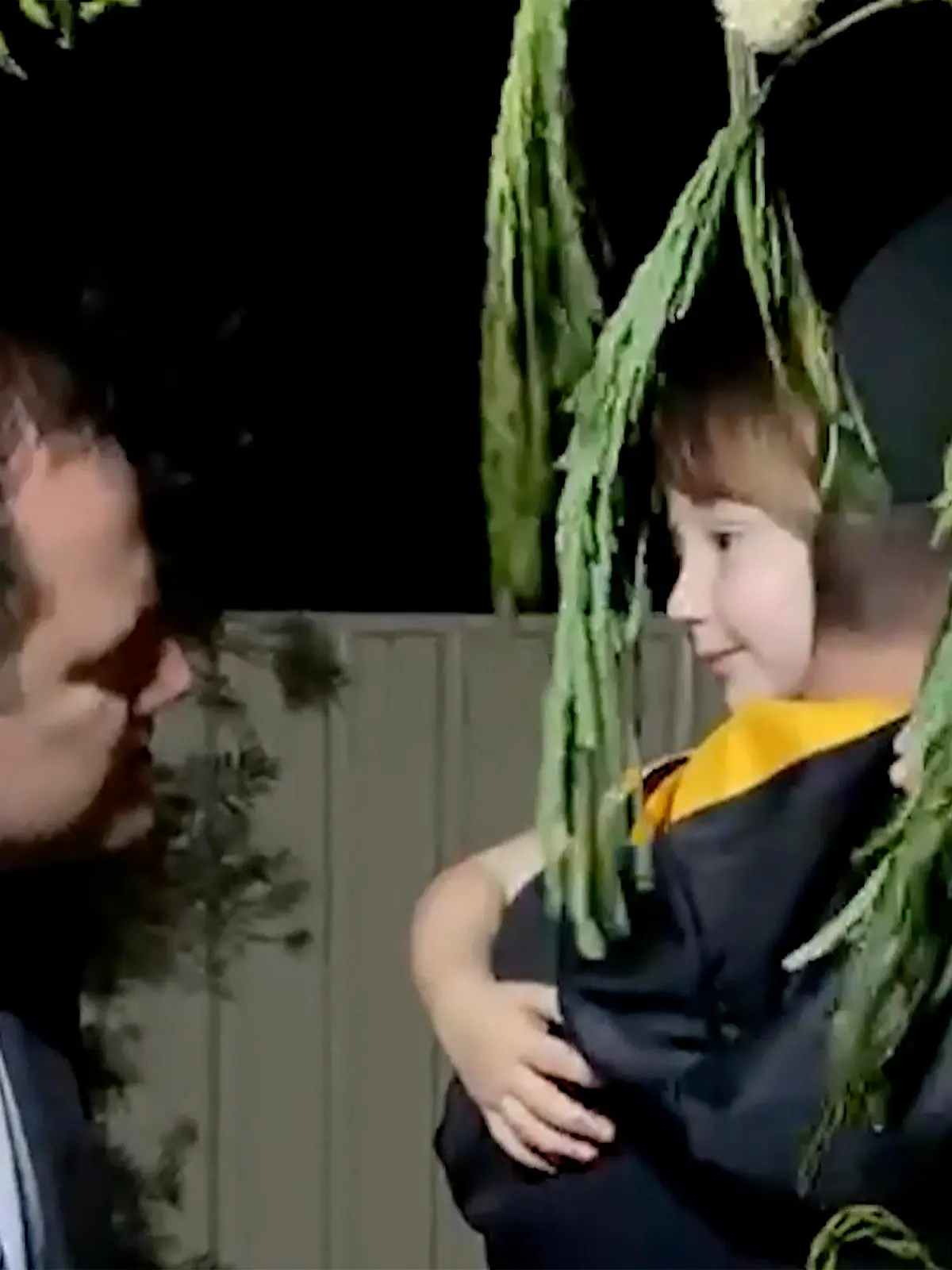 In this image made from a video released by Western Australia Police, a police officer carries  rescued girl Cleo Smith in Carnarvon, Australia Wednesday, Nov. 3, 2021. Police smashed their way into a suburban house on Wednesday and rescued the girl whose disappearance from her family's camping tent on Australia's remote west coast more than two weeks ago both horrified and captivated the nation. (Western Australia Police via AP)