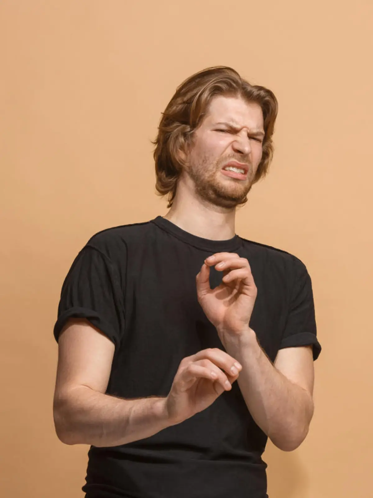 Ew. It's so gross. Young man with disgusted expression repulsing something. Disgust concept. Young emotional man. Human emotions, facial expression concept. Studio. Isolated on trendy pastel color