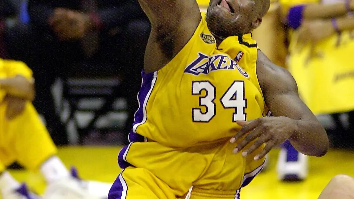 Los Angeles Lakers' Shaquille O'Neal gets his dunk in the first half against the Indiana Pacers in the first half during Game 2 of the NBA Finals at the Staples Center in Los Angeles in this June 9, 2000 file photo. Shaquille O'Neal, a dominant center who played on four NBA championship teams, announced on June 1, 2011, he was planning to retire after a professional career spanning nearly two decades. Picture taken June 9, 2000. REUTERS/Sam Mircovich/Files (UNITED STATES - Tags: SPORT BASKETBALL)