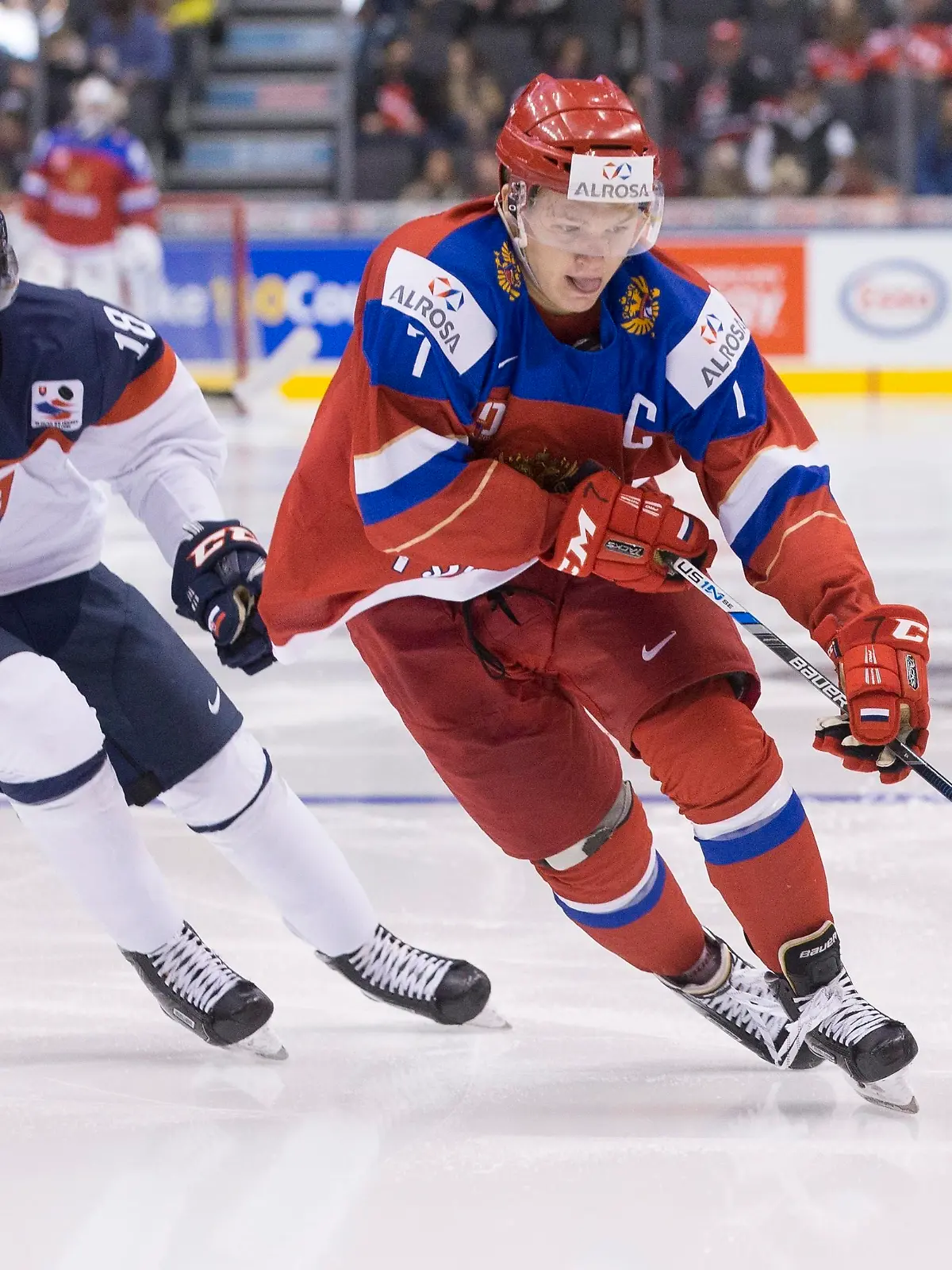 Russia's Kirill Kaprizov skates past Slovakia's Boris Sadecky during the third period of a world junior championship hockey game in Toronto on Saturday, Dec. 31, 2016. (Chris Young/The Canadian Press via AP)