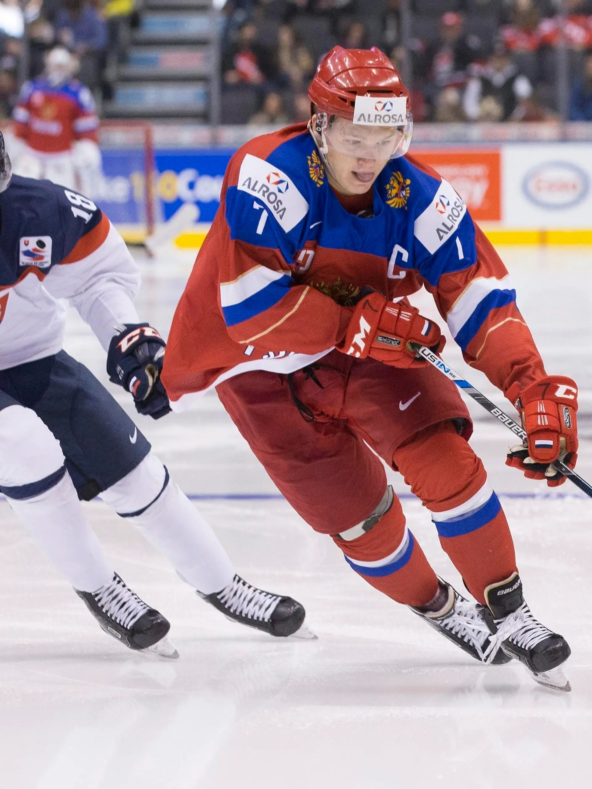 Russia's Kirill Kaprizov skates past Slovakia's Boris Sadecky during the third period of a world junior championship hockey game in Toronto on Saturday, Dec. 31, 2016. (Chris Young/The Canadian Press via AP)