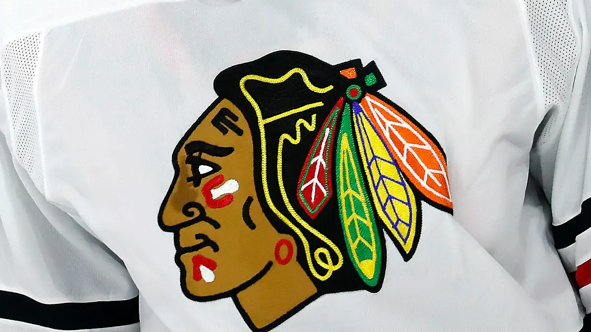 FILE - The Chicago Blackhawks logo is shown on a jersey in Raleigh, N.C., in this May 3, 2021, file photo. The Chicago Blackhawks have hired a former federal prosecutor to conduct an independent review of allegations that a former player was sexually assaulted by a then-assistant coach in 2010. CEO Danny Wirtz announced the move in an internal memo Monday morning, June 28, 2021. (AP Photo/Karl B DeBlaker, File)