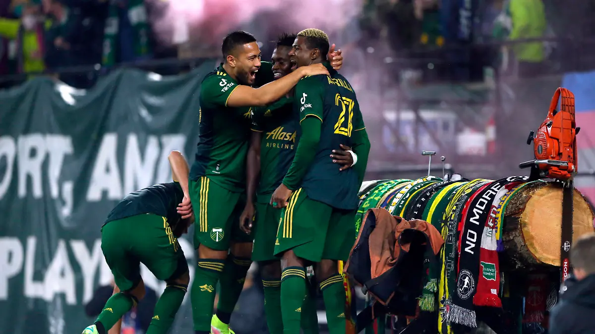 Portland Timbers forward Dairon Asprilla (27) celebrates with teammates after his goal during an MLS soccer game against the San Jose Earthquakes Wednesday, Oct. 27, 2021 in Portland, Ore. (Sean Meagher/The Oregonian via AP)