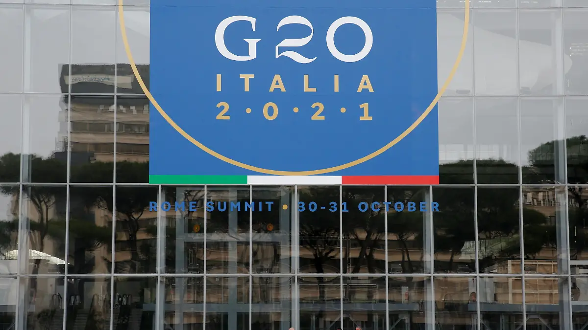 Workers clean in front of the Rome Convention Centre 'La Nuvola', in the city's EUR district, that will host the G20 summit with heads of state from major nations for a two-day meeting from October 30-31, in Rome, Italy, October 22, 2021. REUTERS/Remo Casilli