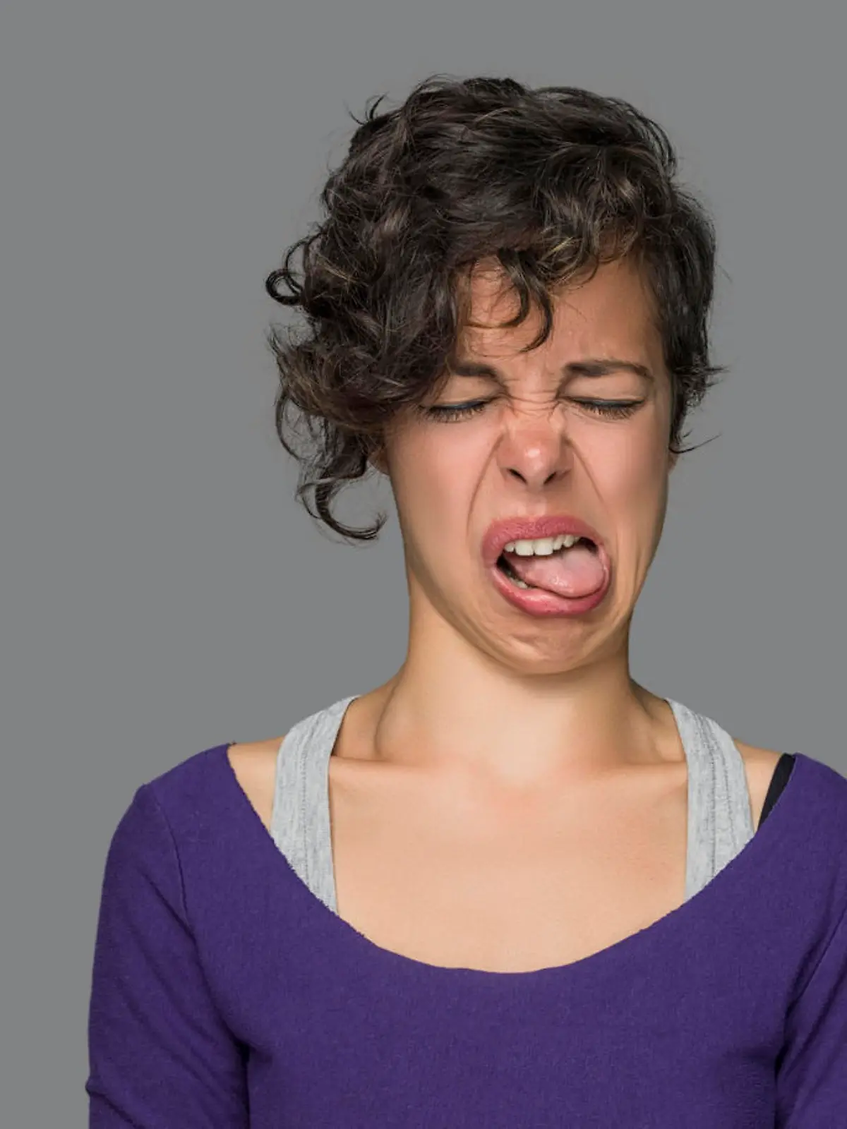 Disgusted Young Woman Sticking Out Tongue