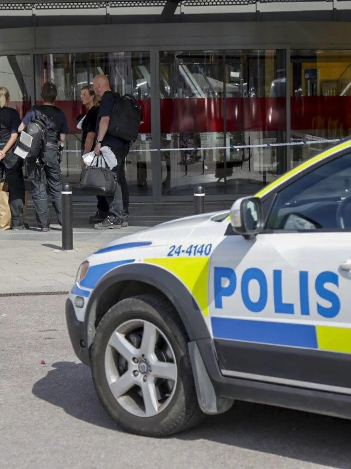 Police officers are seen in front of an Ikea store in Vasteras, central Sweden, August 10, 2015. Two people were killed and one seriously injured in a knife attack at an IKEA store in the city of Vesteras, about an hour west of the Swedish capital Stockholm, police said on Monday. REUTERS/Peter Kruger/TT News Agency ATTENTION EDITORS - THIS IMAGE HAS BEEN SUPPLIED BY A THIRD PARTY. IT IS DISTRIBUTED, EXACTLY AS RECEIVED BY REUTERS, AS A SERVICE TO CLIENTS. SWEDEN OUT. NO COMMERCIAL OR EDITORIAL SALES IN SWEDEN. NO COMMERCIAL SALES. 