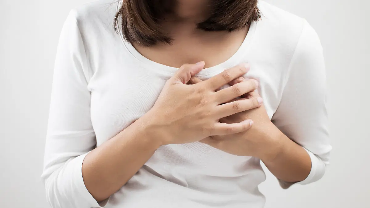 Woman having a pain in the heart area
