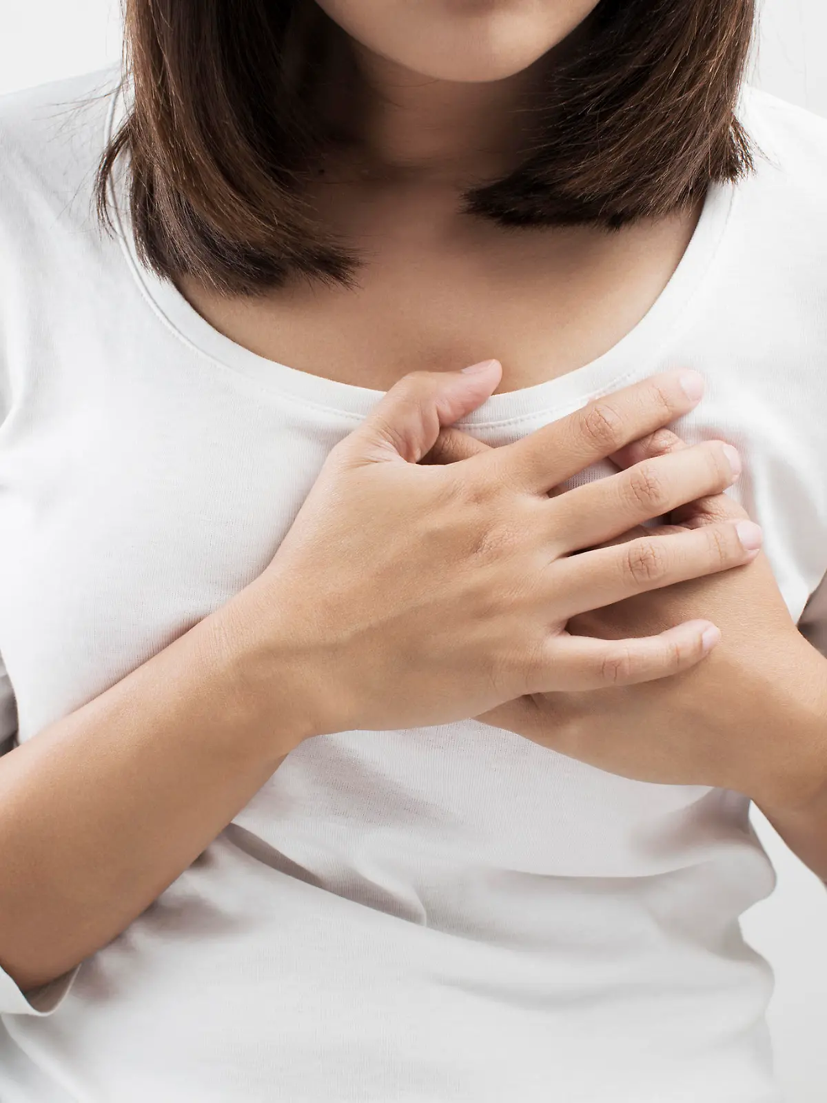 Woman having a pain in the heart area