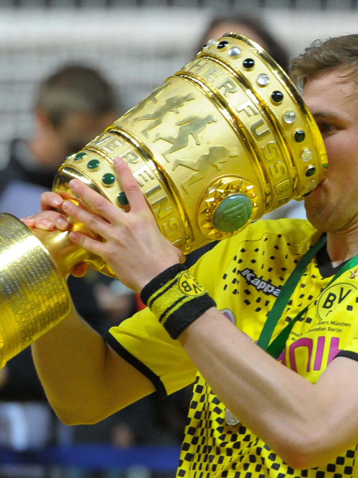 Dortmund's Kevin Grosskreutz celebrates with the trophy after winning the German DFB Cup final soccer match between Borussia Dortmund and FC Bayern Munich at the Olympic Stadium in Berlin, Germany, 12 May 2012. Photo: Soeren Stache dpa/lbn (ATTENTION: The DFB prohibits the utilisation and publication of sequential pictures on the internet and other online media during the match (including half-time). ATTENTION: BLOCKING PERIOD! The DFB permits the further utilisation and publication of the pictures for mobile services (especially MMS) and for DVB-H and DMB only after the end of the match.)  +++(c) dpa - Bildfunk+++
